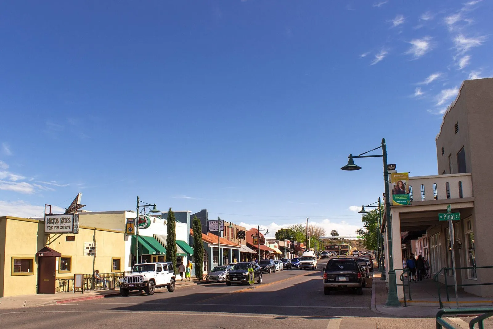 Storefronts and parked cars along the historic main street of Old Town Cottonwood, Arizona