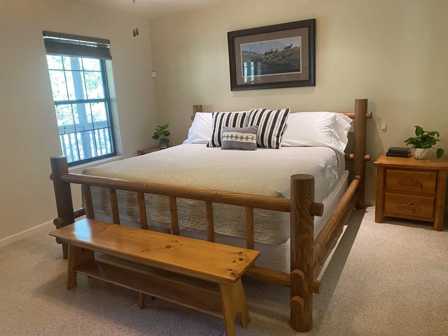Bedroom with a handcrafted log bed