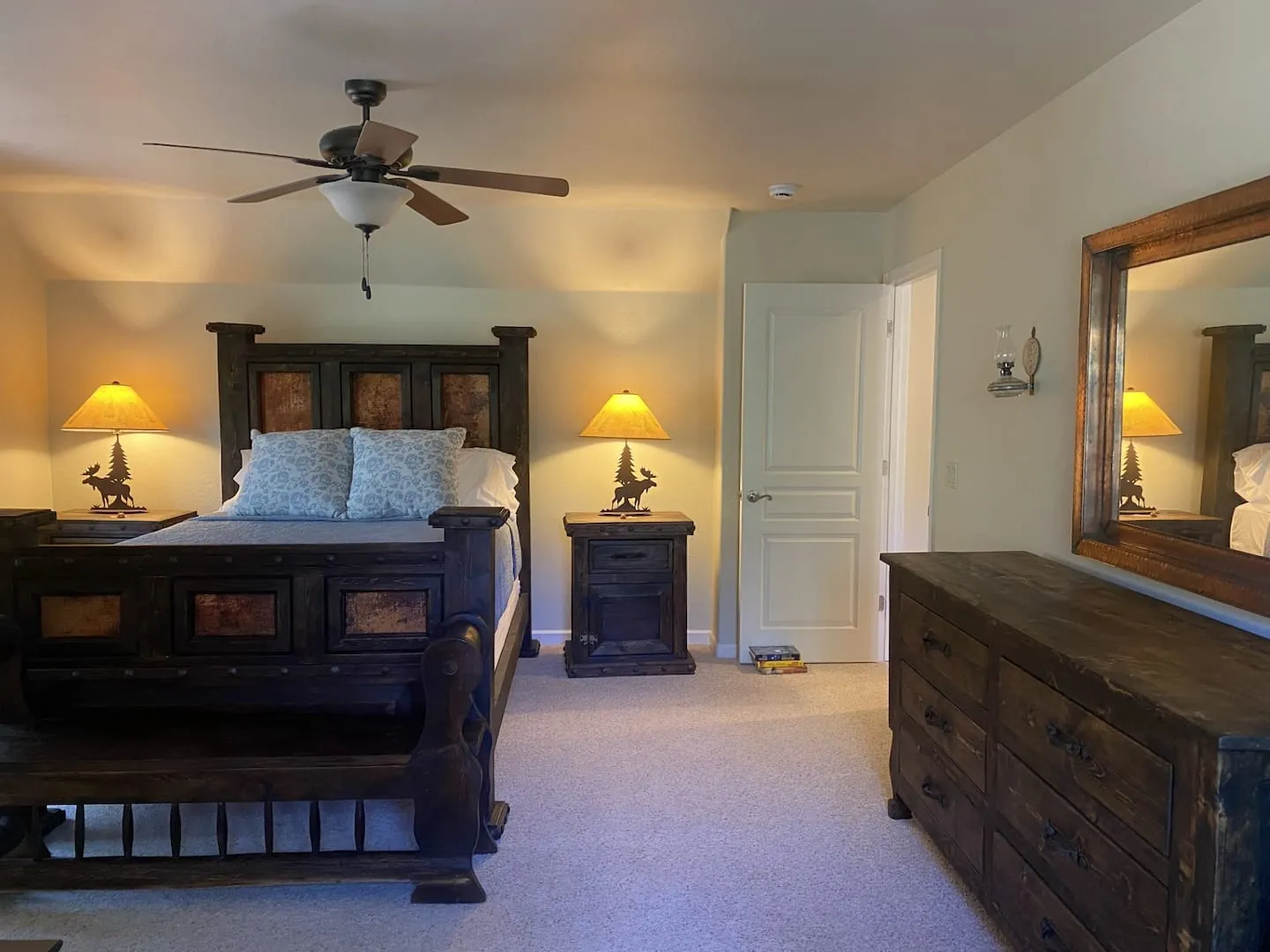 Bedroom with a queen bed and forest views
